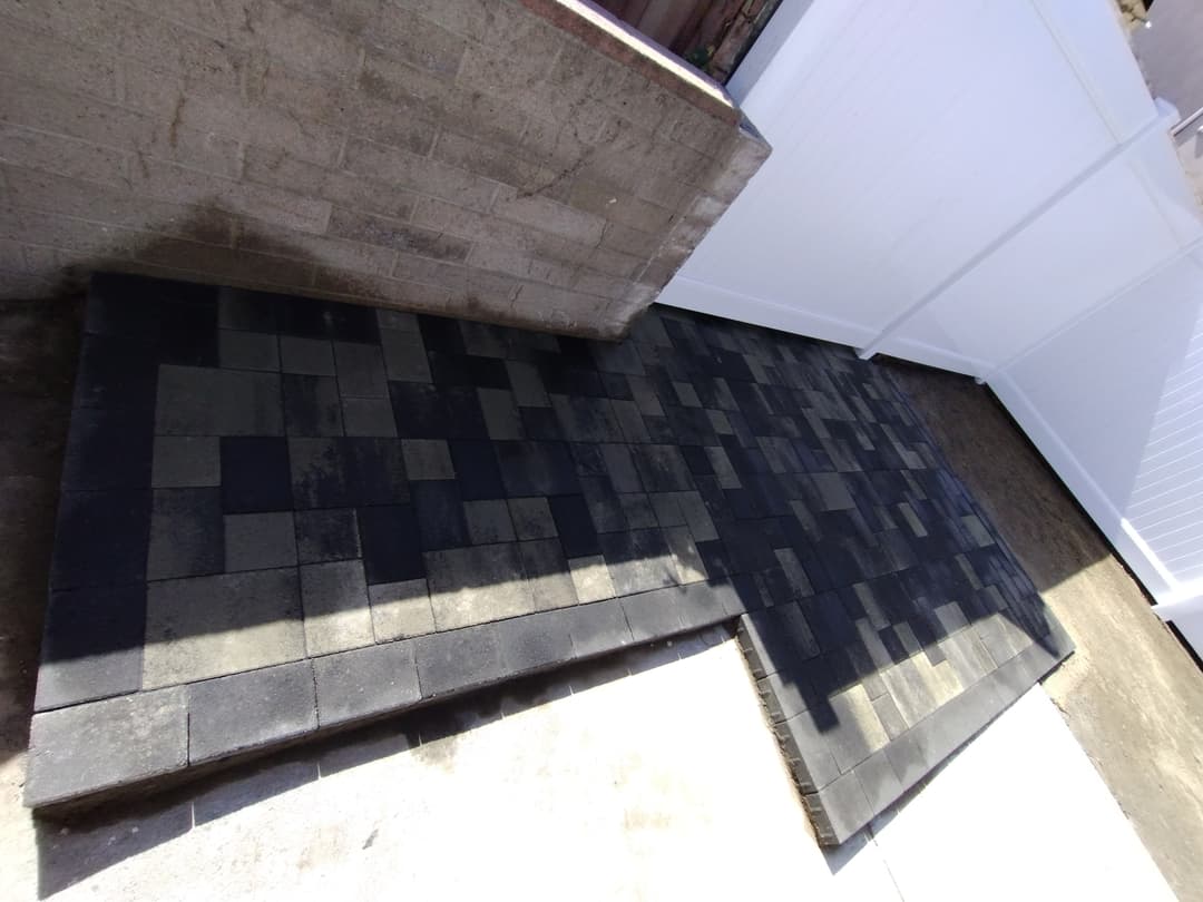 newly installed dark paver pathway