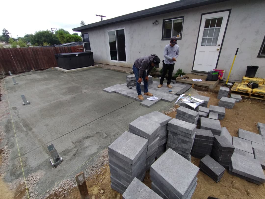 paver installation in progress with crew working